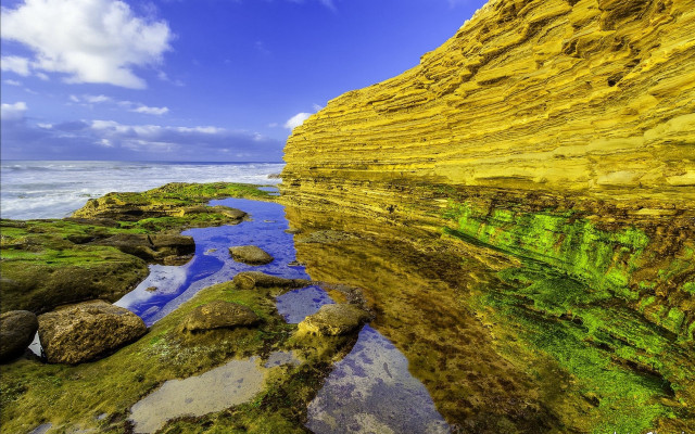 Rocky shore mossy rocks cloudy free wallpaper for desktop - medium preview image