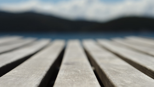 Wooden table sky mountain blur free wallpaper for desktop - medium preview image