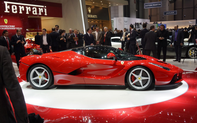 Red sports car showroom crowd free wallpaper for desktop - medium preview image