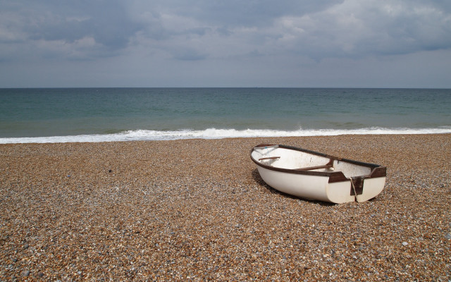 Boat beach cloudy sky ocean free wallpaper for desktop - medium preview image