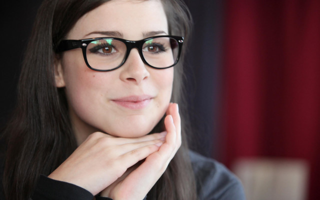 Woman glasses blackshirt hand chin free wallpaper for desktop - medium preview image