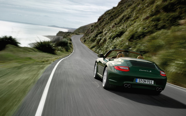 Green sports car cliffside ocean free wallpaper for desktop - medium preview image