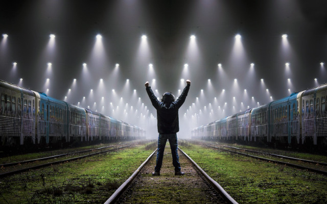 Man standing train track urban free wallpaper for desktop - medium preview image