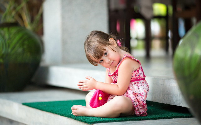 Little girl smiling bokeh pink free wallpaper for desktop - medium preview image