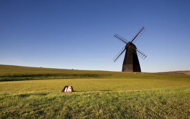 Windmill field person tiltshift sunset #2 free wallpaper for desktop - medium preview image