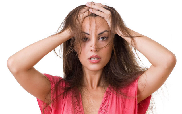 Concerned woman holding hair shock free wallpaper for desktop - medium preview image