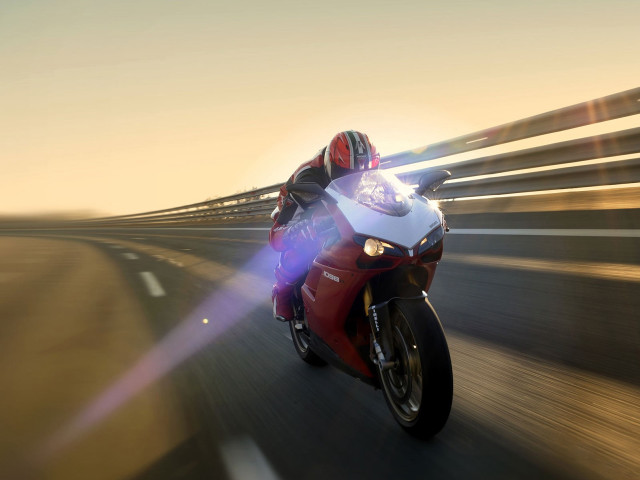 Motorcycle rider highway brightlight blurrybackground free wallpaper for desktop - medium preview image