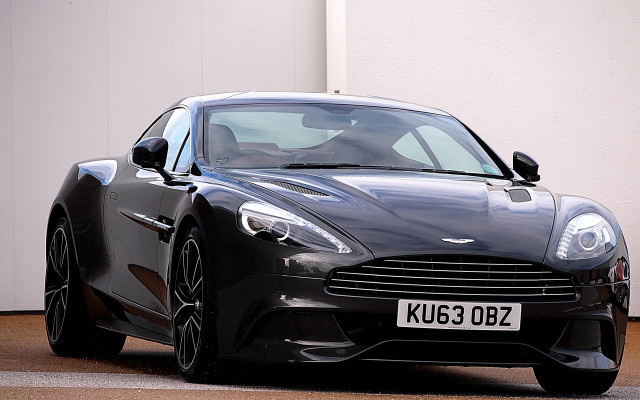 Black sports car white building free wallpaper for desktop - medium preview image