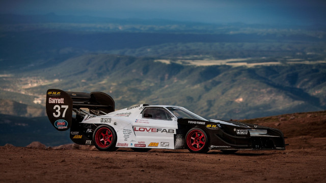 Car mountains dirt road sunset free wallpaper for desktop - medium preview image