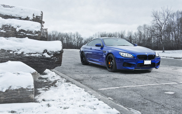 Blue car snowy road forest free wallpaper for desktop - medium preview image