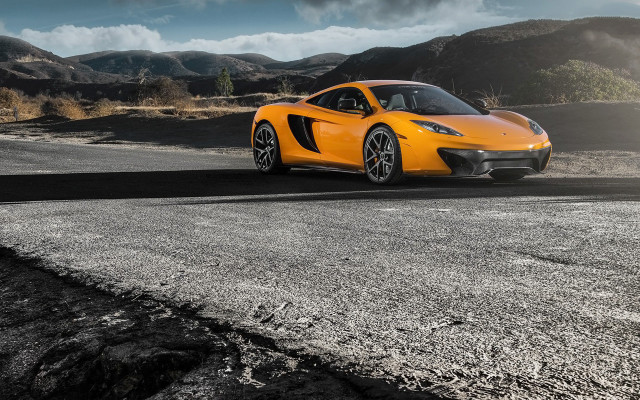 Yellow sports car mountains cloudy free wallpaper for desktop - medium preview image