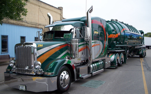Green orange truck driving street free wallpaper for desktop - medium preview image