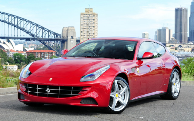 Red sports car bridge city free wallpaper for desktop - medium preview image