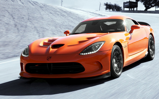Bright orange sports car snowy free wallpaper for desktop - medium preview image