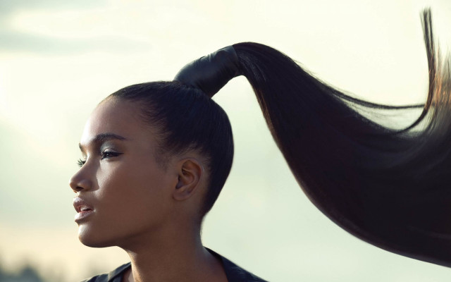 Afrofuturism surrealist portrait ponytailed woman free wallpaper for desktop - medium preview image