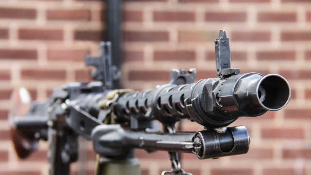 Machine gun brick wall precisionism free wallpaper for desktop - medium preview image
