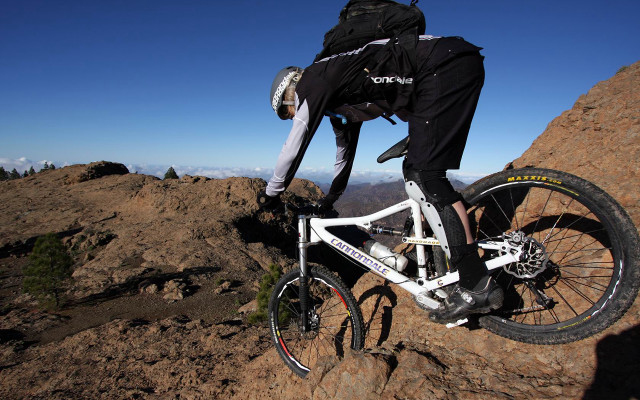 Man riding mountain bike rocky free wallpaper for desktop - medium preview image