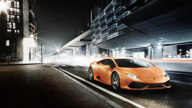 Orange sports car night cityscape free wallpaper for desktop - medium preview image