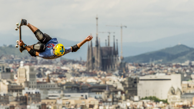 Skateboarder cityscape cathedral hyperrealistic motionblur free wallpaper for desktop - medium preview image