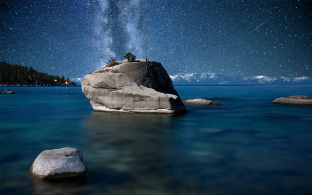 Person rock ocean night starry free wallpaper for desktop - medium preview image