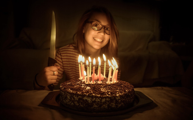 Woman holding knife cake lit free wallpaper for desktop - medium preview image