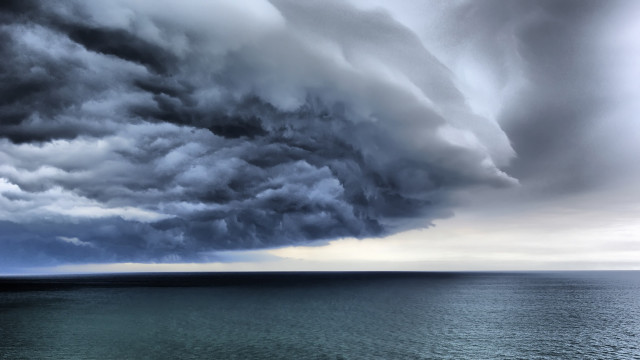 Storm cloud ocean boat matte free wallpaper for desktop - medium preview image