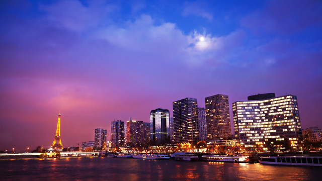 City skyline river boats night free wallpaper for desktop - medium preview image