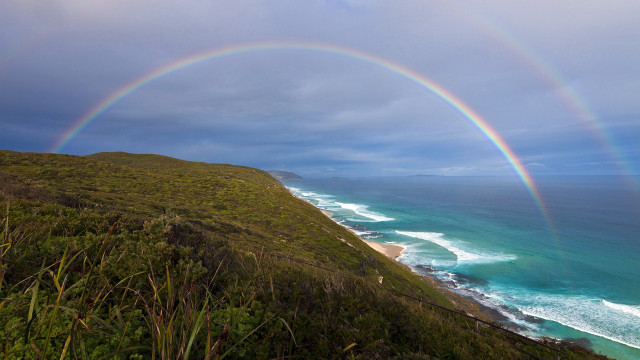 Rainbow beach cliff ocean cloudy free wallpaper for desktop - medium preview image