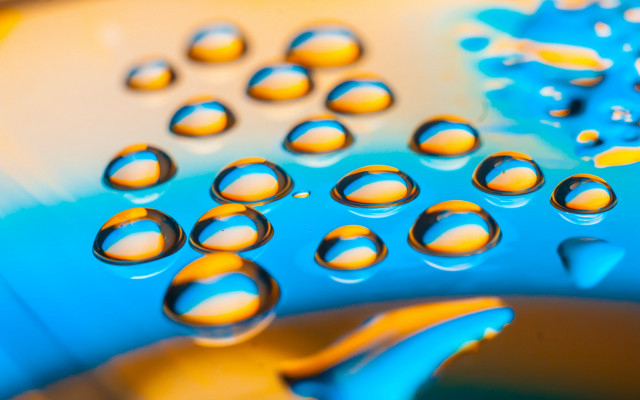 Blue yellow water drops macro free wallpaper for desktop - medium preview image
