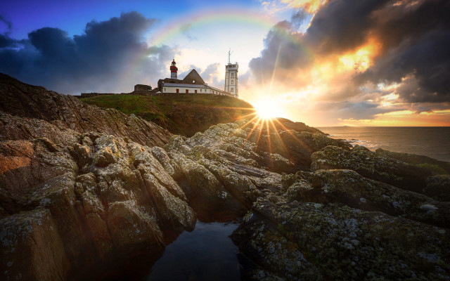 Lighthouse rocky cliff rainbow city free wallpaper for desktop - medium preview image