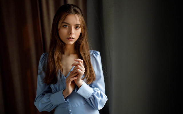 Woman blue shirt serious portrait free wallpaper for desktop - medium preview image