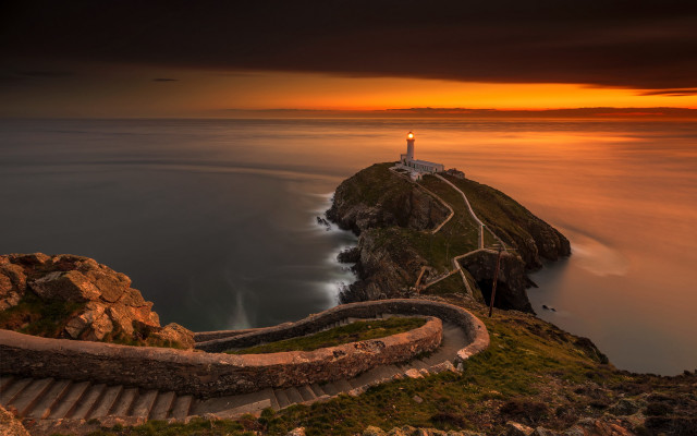 Lighthouse cliff stairway sunset cloudy free wallpaper for desktop - medium preview image