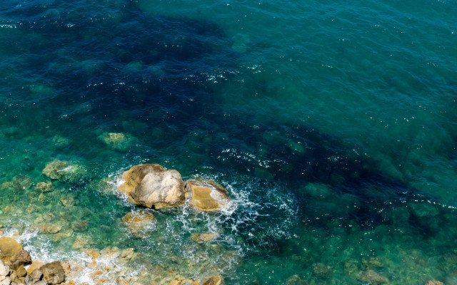 Water rocks boat person impressionist free wallpaper for desktop - medium preview image