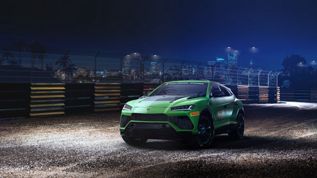 Green sports car night cityscape free wallpaper for desktop - medium preview image
