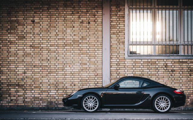 Black sports car brick building free wallpaper for desktop - medium preview image