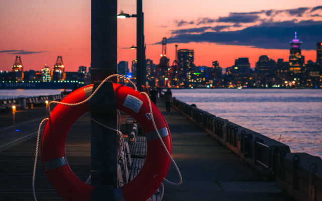 Life preserver pole sunset cityscape free wallpaper for desktop - medium preview image