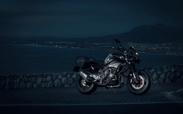 Motorcycle cobblestone night city water free wallpaper for desktop - medium preview image