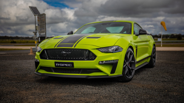 Bright yellow mustang parking lot free wallpaper for desktop - medium preview image