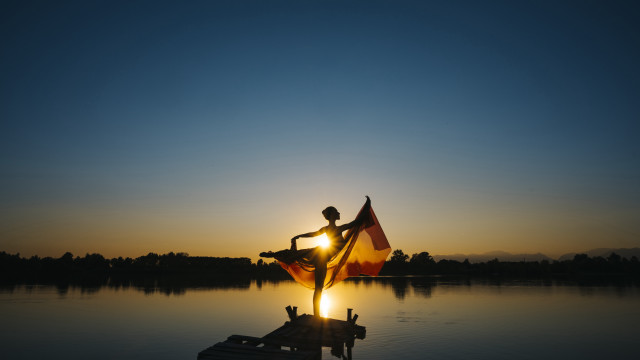 Dusk sunset flag person dock free wallpaper for desktop - medium preview image
