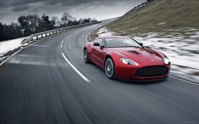 Red sports car driving snow free wallpaper for desktop - medium preview image