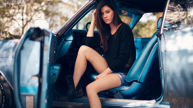 Woman sitting blue truck blurry free wallpaper for desktop - medium preview image