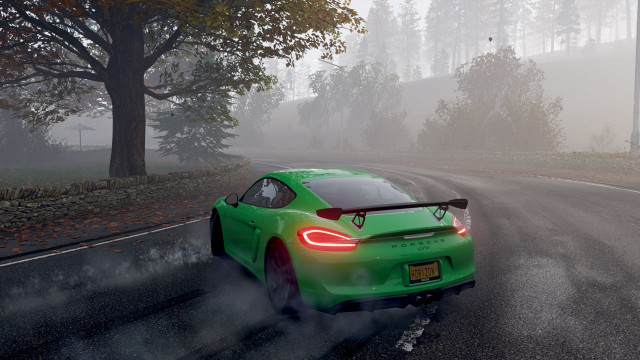 Green sports car foggy road free wallpaper for desktop - medium preview image