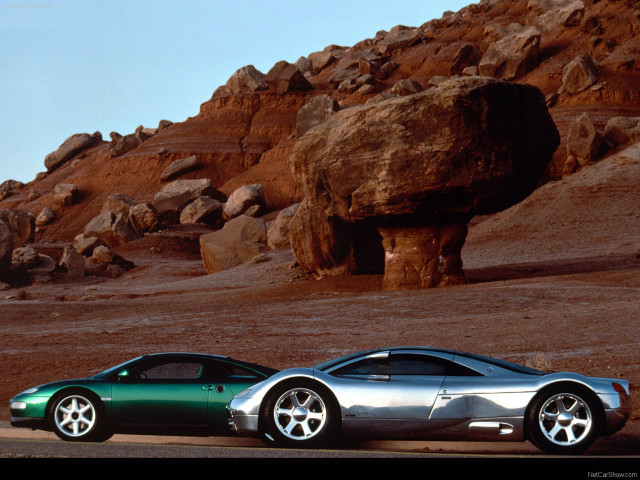 Two cars desert rock formation free wallpaper for desktop - medium preview image