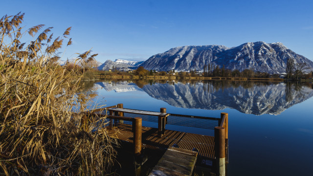 Lake dock bench mountains sky free wallpaper for desktop - medium preview image
