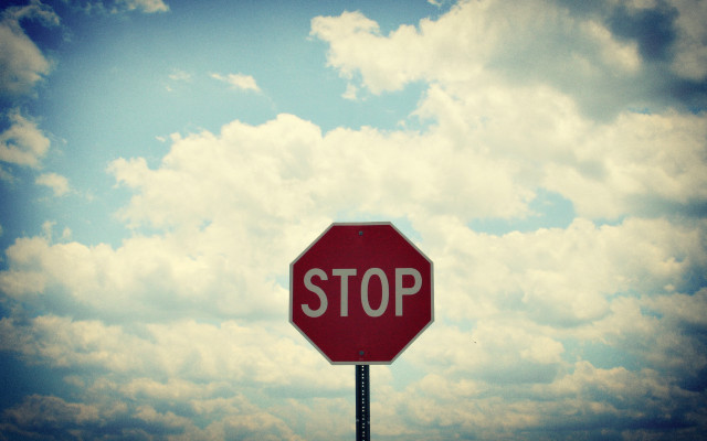 Stop sign sky clouds cityscape free wallpaper for desktop - medium preview image
