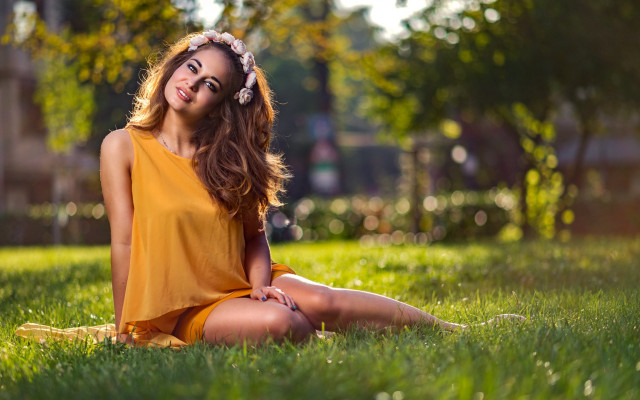 Woman sitting yellow dress smiling free wallpaper for desktop - medium preview image