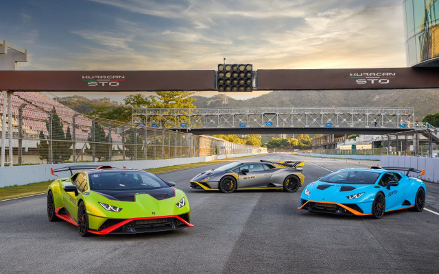 Three colored sports cars race free wallpaper for desktop - medium preview image
