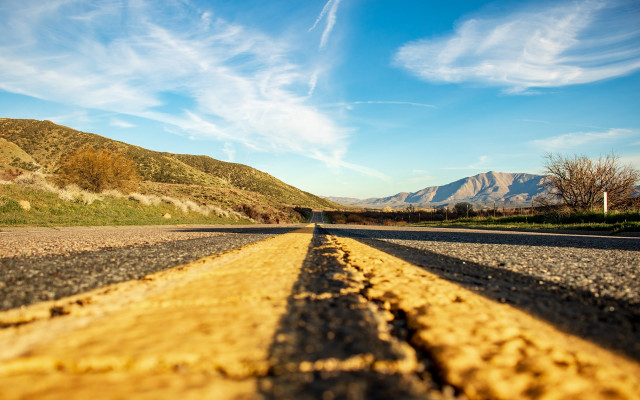 Mountain road yellow line ocean free wallpaper for desktop - medium preview image