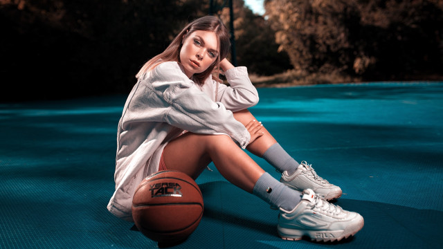 Woman basketball sitting outdoors portrait free wallpaper for desktop - medium preview image