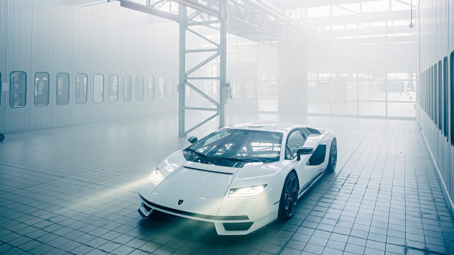 White sports car large building free wallpaper for desktop - medium preview image